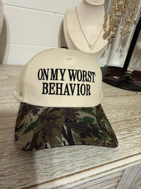on worst behavior trucker hat with cow print